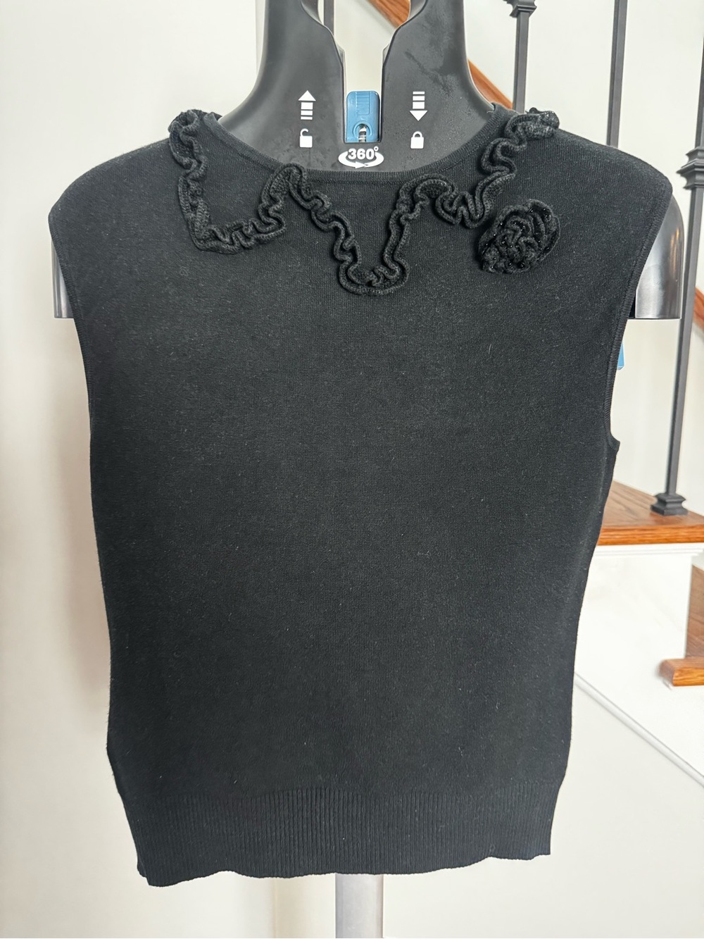 Black Sleeveless Knit Tank with Ruffled Neck and Rosette